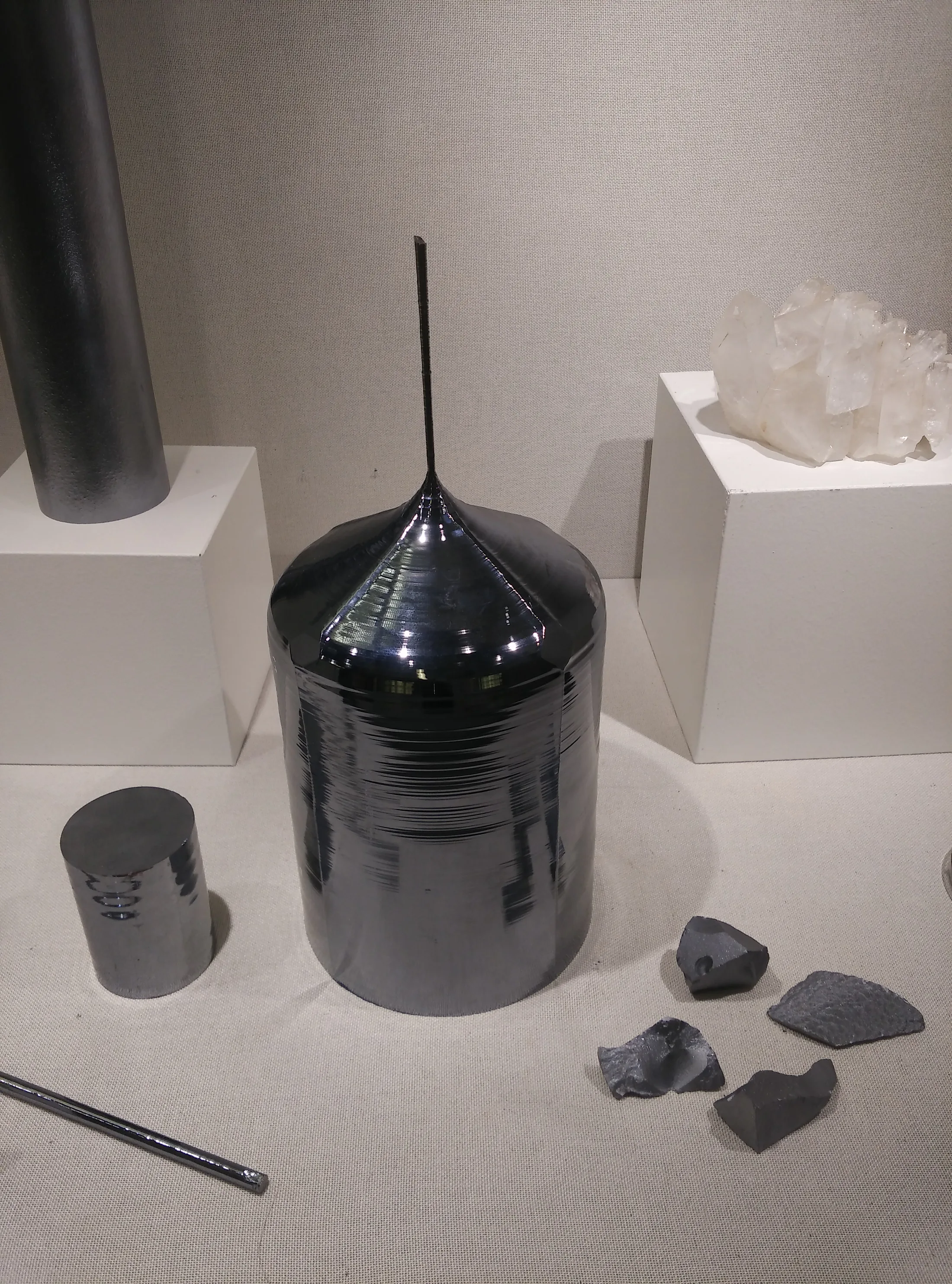 Monocrystalline silicon ingot (Czochralski boule) with seed neck, museum display